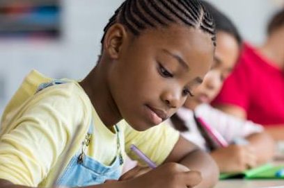 student writing entry exam